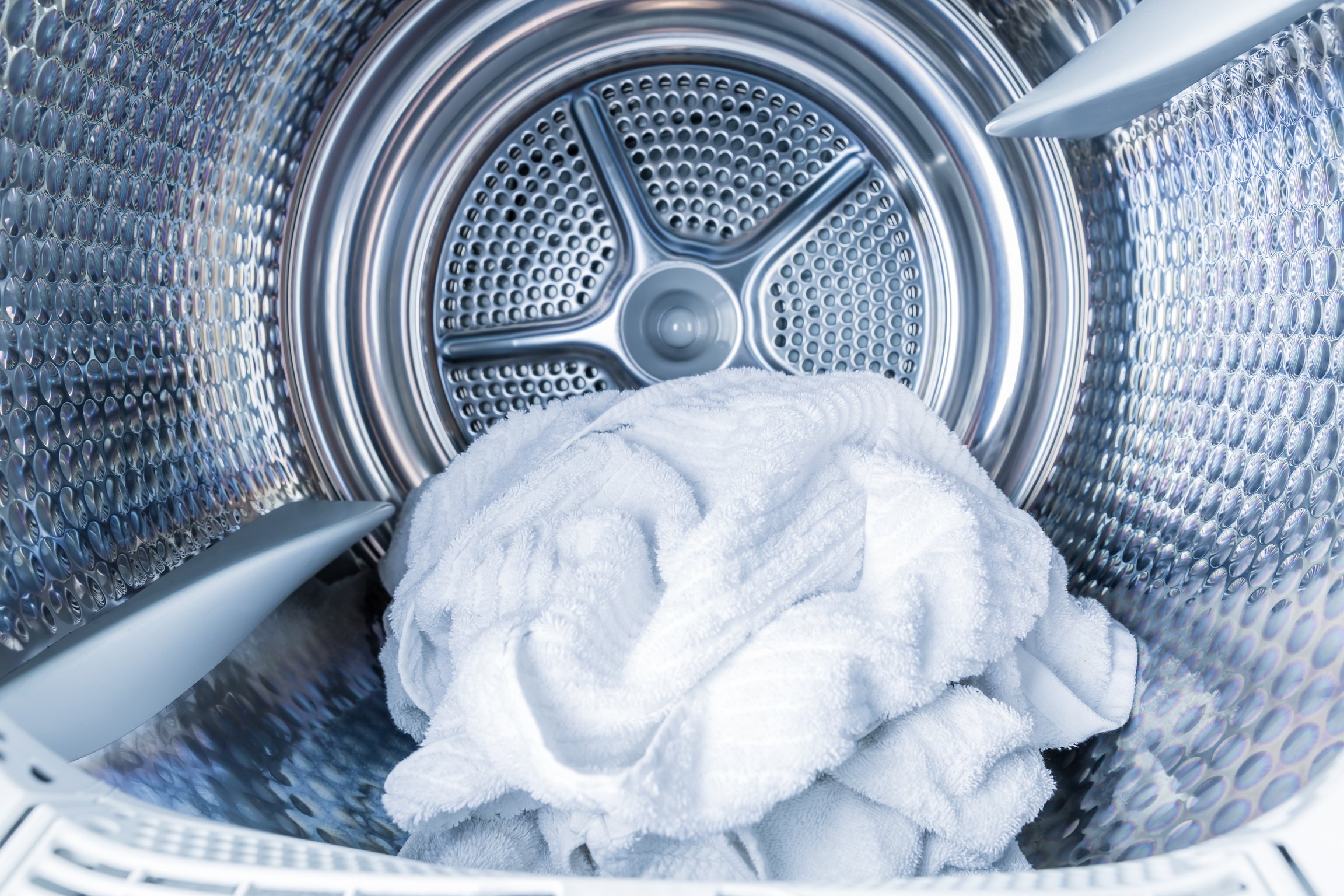 Inside of Tumble Dryer with Clean White Towels